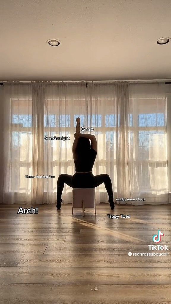 a person doing a yoga pose in front of a window with the words archi on it