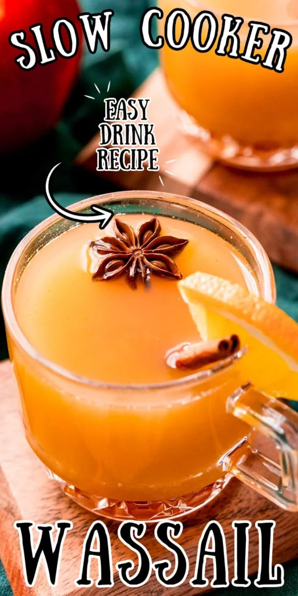 the cover of slow cooker easy drink recipe wassail with an apple and cinnamon garnish