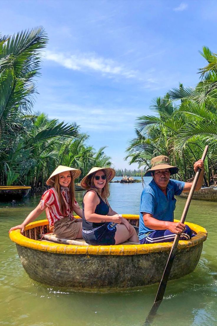 three people in a boat on the water