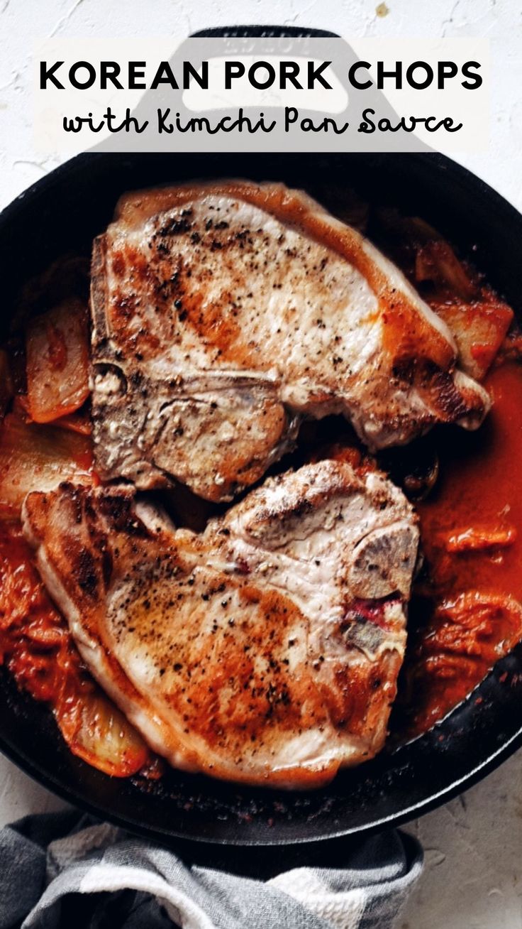 korean pork chops with kimchi pan sauce in a cast iron skillet on a white background