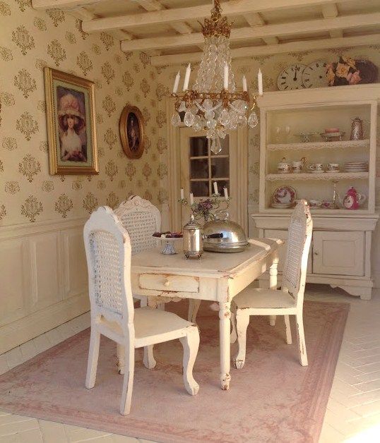 a white table and chairs in a room