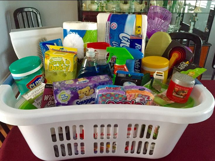 a laundry basket filled with lots of cleaning supplies