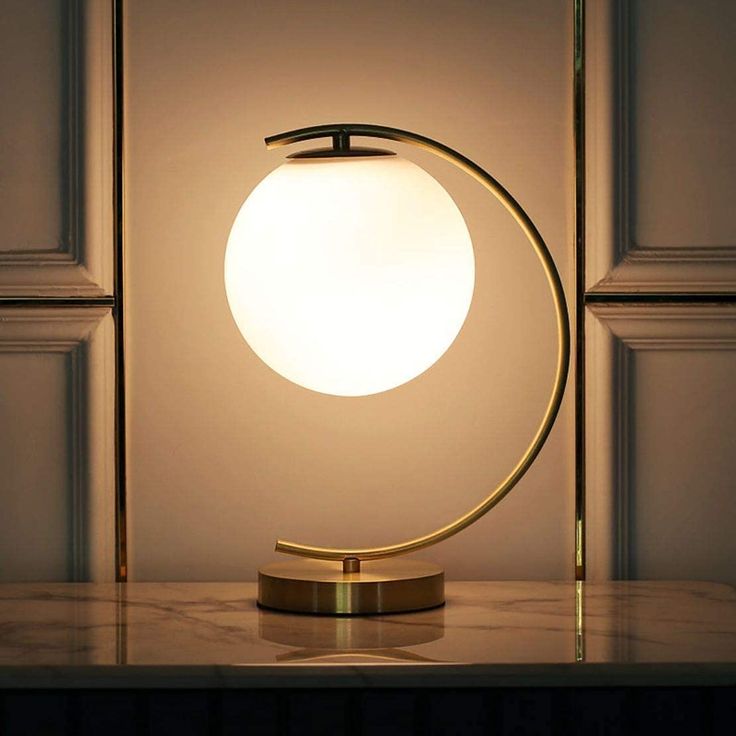 an illuminated table lamp on a marble surface