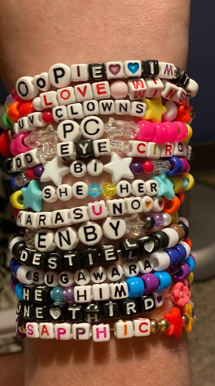 Custom personalized pronoun bracelets. All pronouns are welcomed! Our shop (+this listing) is a judgement free, welcoming zone ! Your arm will look beautiful in our amazing custom patterned kandi bracelets <3 We offer all colors of the rainbow, plus a few extra shades, and various specialty beads. If you have something specific in mind, please message us beforehand to see if it's possible! Please refer to the last photo to see an example of our variety :D Check out our shop for more listings: White Customizable Novelty Jewelry, Customizable Novelty White Jewelry, Customizable White Novelty Jewelry, Personalized Multicolor Kpop Style Bracelets, Kpop Style Personalized Multicolor Bracelets, Customized Multicolor Kpop Bracelets, Personalized Multicolor Kpop Style Jewelry, Trendy White Bracelet With Custom Text, Kpop Style Personalized Multicolor Jewelry