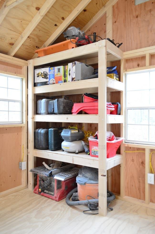 the inside of a storage room with lots of tools and supplies on it's shelves