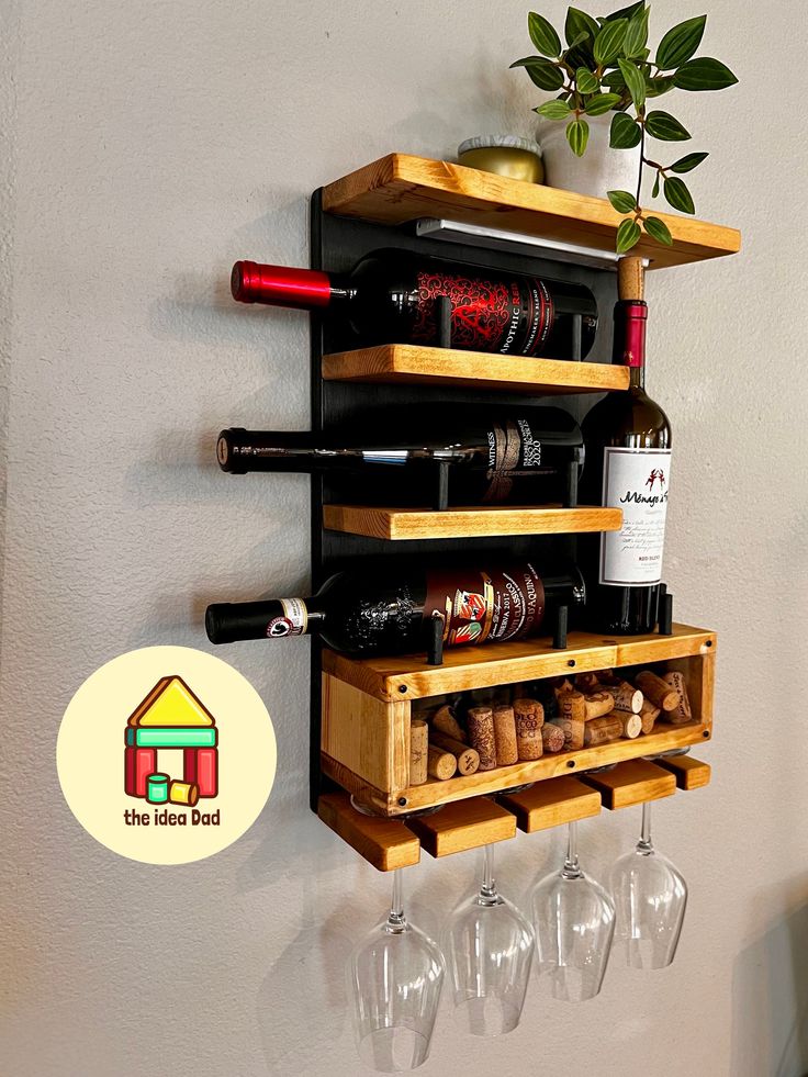 a wooden wine rack holding several bottles and glasses