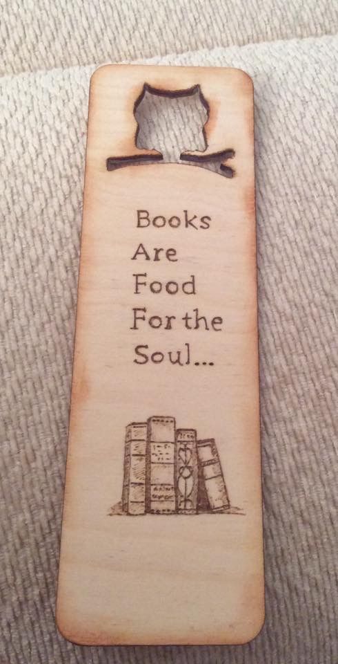 a wooden bookmark with the words books are food for the soul