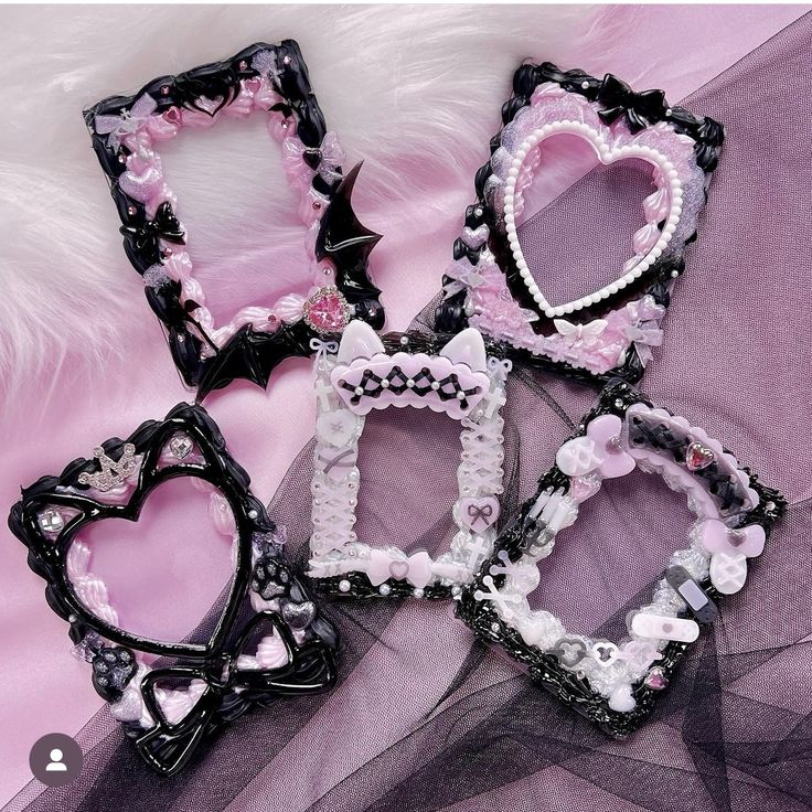 four frames are decorated with pink and black beads on a purple background, one is shaped like a heart