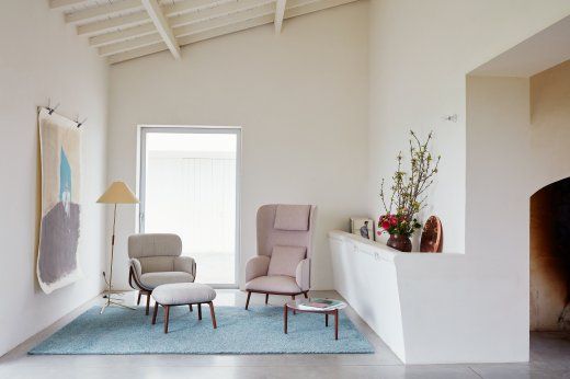 a living room filled with furniture and a fire place