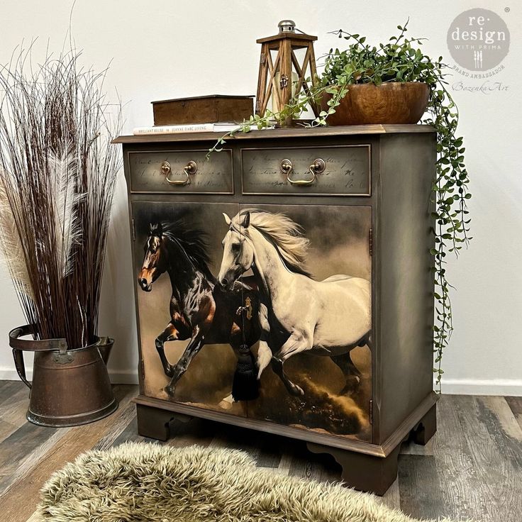 two horses running through the air on an old dresser