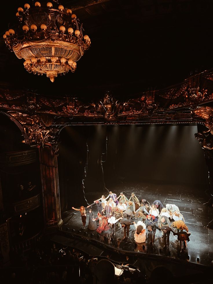 a group of people standing on top of a stage