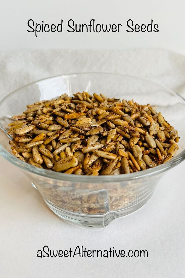 a glass bowl filled with sunflower seeds