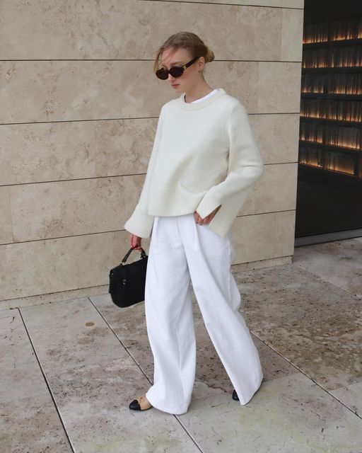 Iris | Outfit inspiration on Instagram: "White outfits hit different 🤍 Jumper: @wakakuuicons Trousers: @karen_millen * Shoes: @chanelofficial * Bag: @burkely * Sunglasses: @celine #whiteoutfit #whitetrousers #scandinavianfashion #scandifashion #beigeaesthetic #parisification #minimalistwardrobe #outfitdujour #minimalstyleblogger #theparisianchique #capsulecloset #capsulecollection #parisianamour #capsule #simplefits #autumnoutfit #everydayfashion" White Tonal Outfit, Monochromatic White Outfit, White Trousers Outfit Winter, Monochromatic Outfit White, White Monochromatic Outfit, Trousers Outfit Winter, White Trousers Outfit, Sunglasses Celine, Scandi Fashion