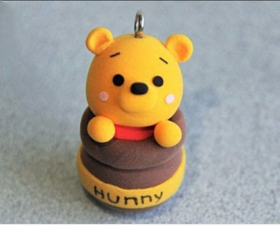 a winnie the pooh keychain sitting on top of a table