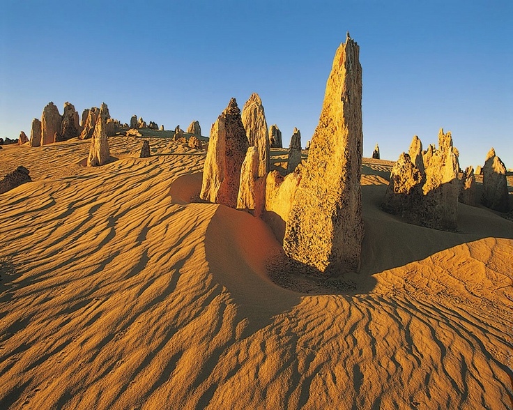 the desert is covered in large rocks and sand