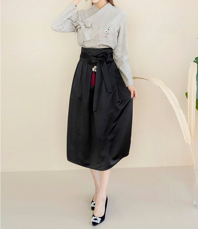 This is a Korean Modern Women's Hanbok satin skirt suitable for spring/fall and summer. This skirt is not a wrap style, but can be worn comfortably with a side zipper and elastic waistband at the back. A design that looks like the fabric itself has wrinkles is a characteristic of the fabric. Please note that this is not a reason for return. This hanbok is modernly designed so you can wear it comfortably and beautifully. This modern hanbok is perfect dress for daily and celebrations such as parti Spring Satin Full Skirt, Spring Full Satin Skirt, Evening Flared Wrap Skirt For Spring, Flowy Satin Skirt For Fall, Satin Skirt For Fall Evening, Satin Skirt For Evening In Fall, Spring Satin Pleated Lined Skirt, Spring Party Midi Wrap Skirt, Spring Party Silk Wrap Skirt