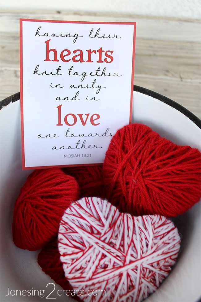 two yarn hearts in a bowl with a card saying, having their hearts knit together and why they are love