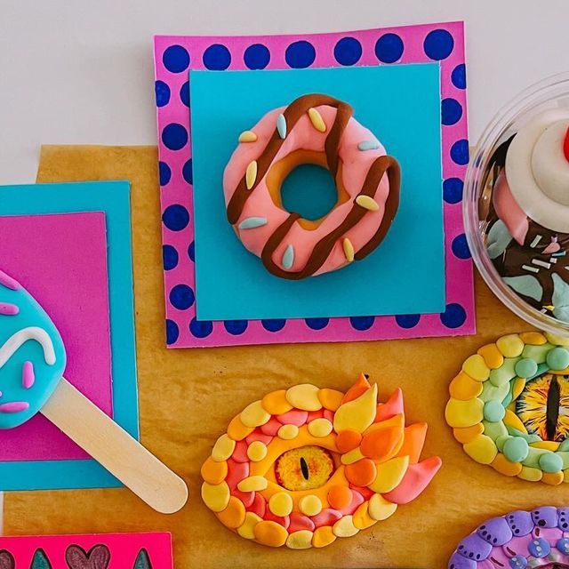 there are many decorated donuts on the table