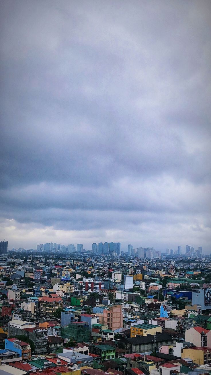 the cityscape is covered in many different colored buildings