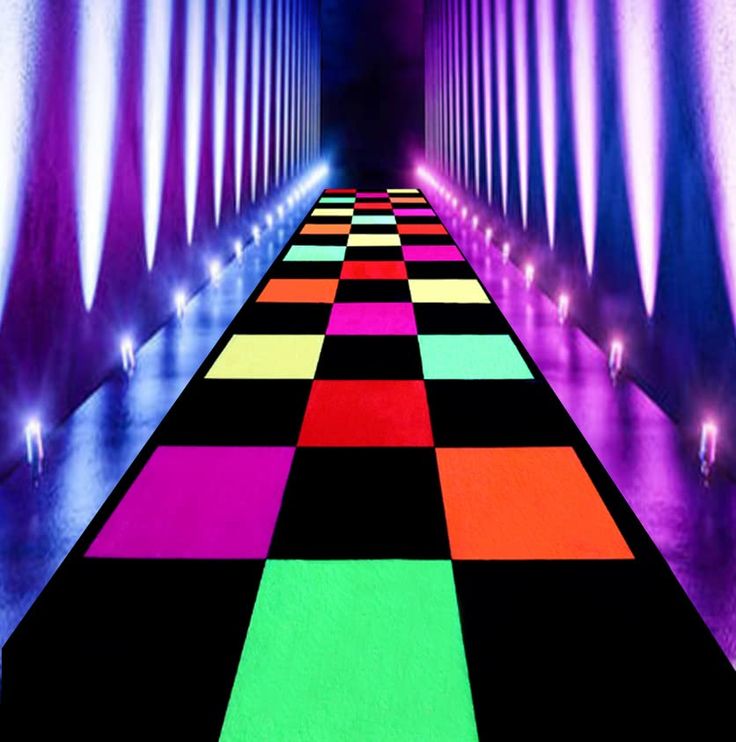 a brightly lit hallway with colorful carpeting and lights at the end, leading into a tunnel