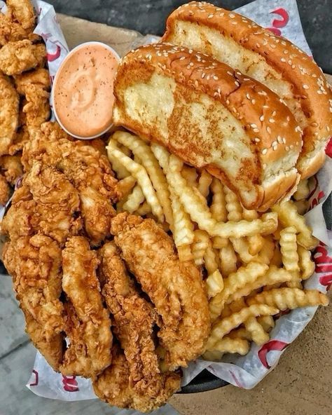 fried chicken, french fries and coleslaw on a paper plate