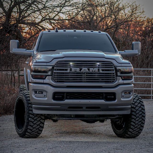 the front end of a silver ram truck