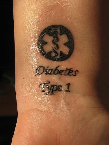 a small wrist tattoo with the words diabettes type 1 on it