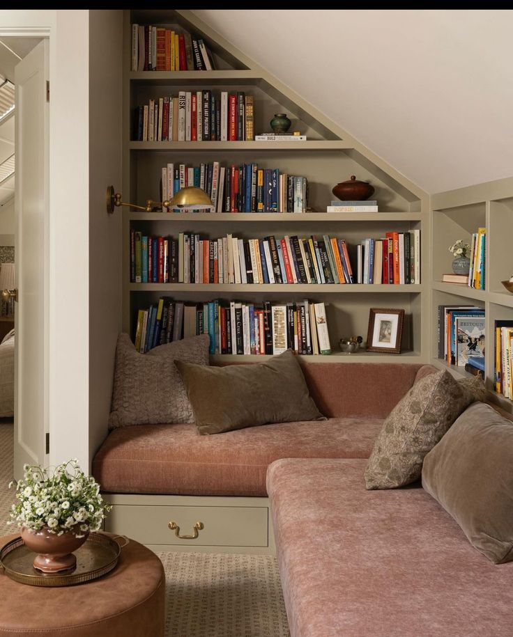 a living room filled with lots of books