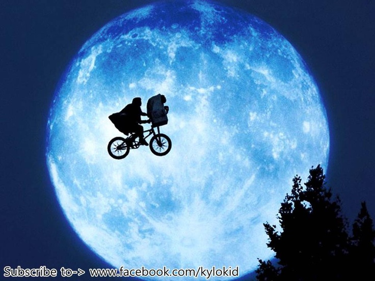 a person riding a bike in front of a full moon with the caption turns out his last name was cetera