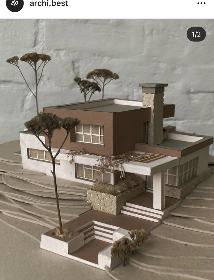 a model of a house with trees growing out of it