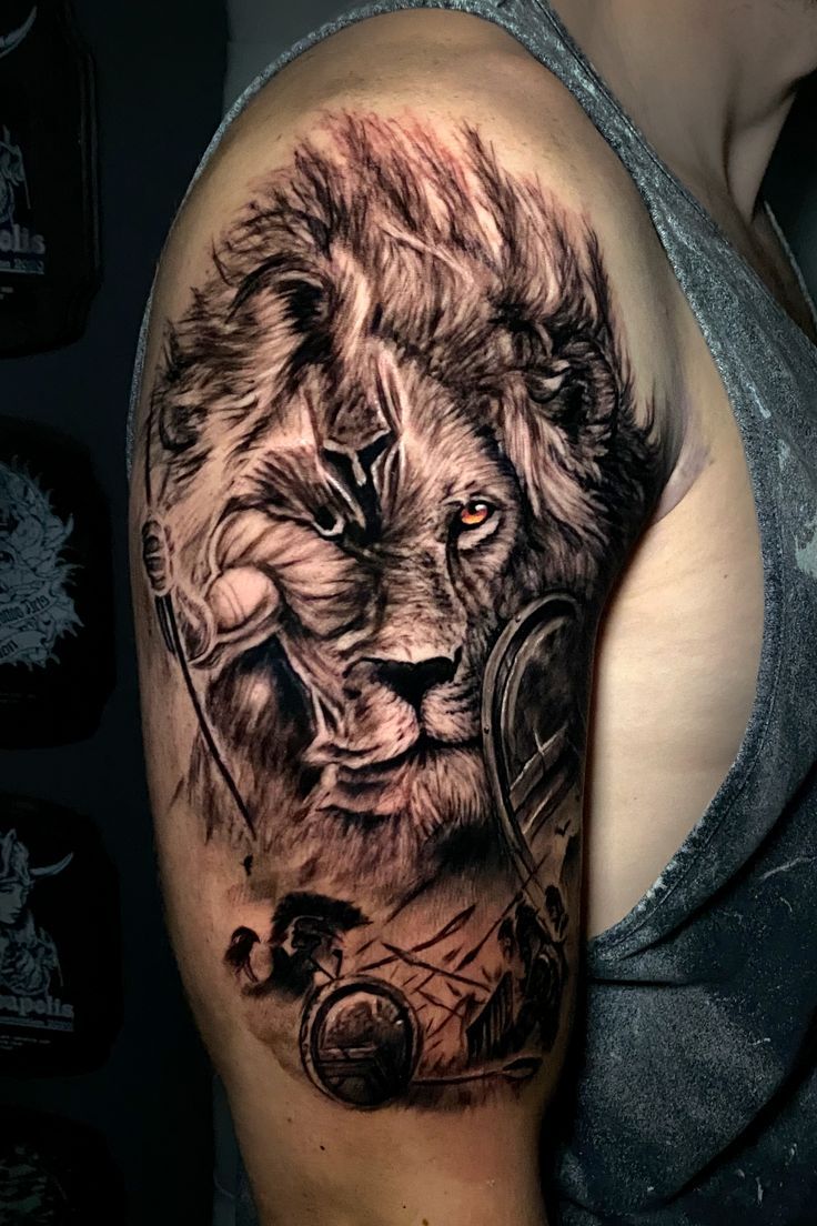 a man with a lion tattoo on his arm