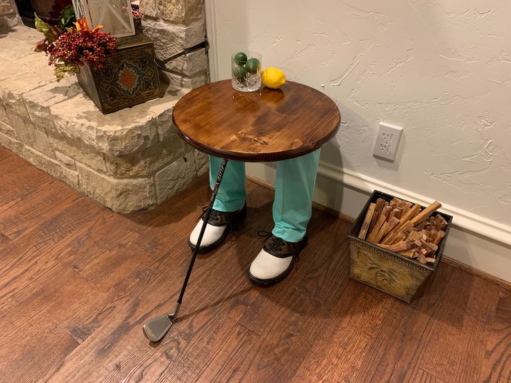 a person standing in front of a table with some sticks on it and a basket full of lemons