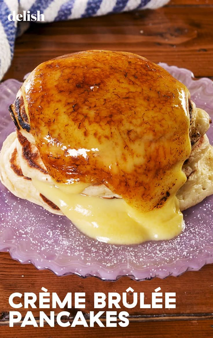 a close up of a plate of food on a table with text overlay that reads creme brule pancakes