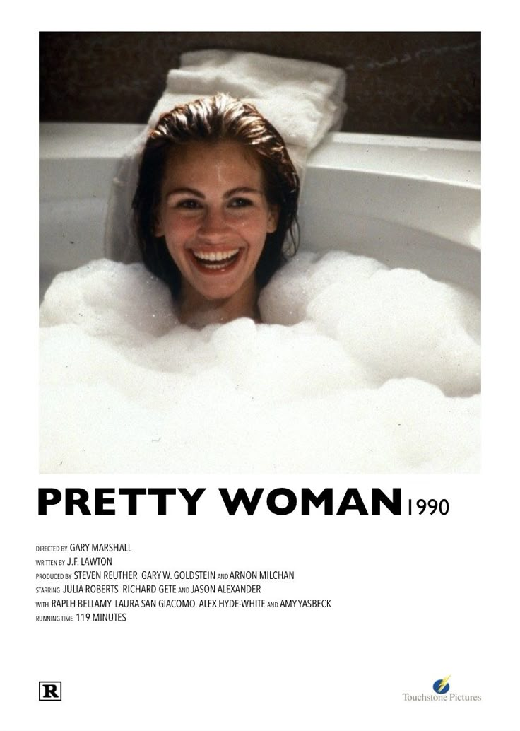 a woman in a bathtub smiling for the camera