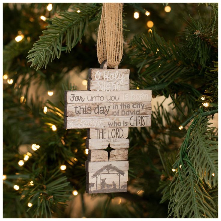 a wooden ornament hanging from a christmas tree