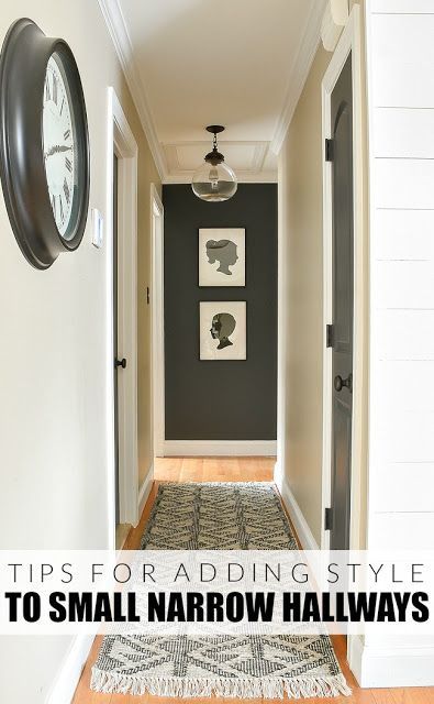 a hallway with black walls and white trim on the wall, along with a clock that reads tips for adding style to small narrow hallways