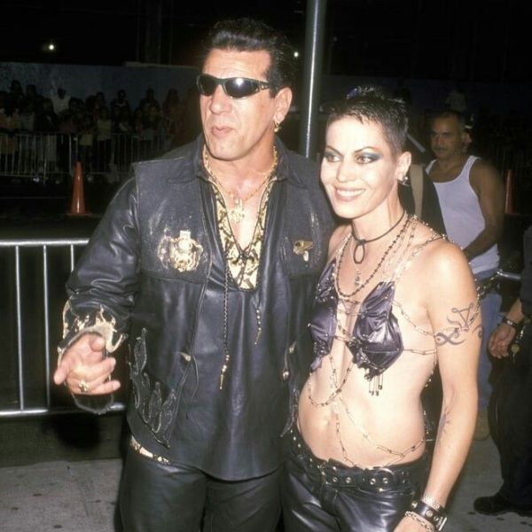 a man and woman dressed up in leather clothes