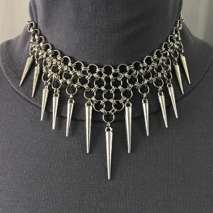 Even If You Be Little, Be Fierce, With This Warrior-Style Handmade Spiked Necklace! This Silver Necklace Features Comfy, Flexible Layers Of Chainmail Links With Spikes At The Ends. The Middle 3 Spikes Are Slightly Longer Than The Rest. It Has The Versatility Of Being Very Adjustable, So It Can Be Worn Tighter As A Choker For A More Gothic, Punk, Or Emo Look. Or You Can Wear It Looser (As In Pictures 2 And 9) For A More Tribal Vibe. This Unisex Warrior Necklace Has Been Newly Handmade Just For Yo Chainmail Jewelry Necklaces, Gothic Chainmail Jewelry, Silver Chainmail Necklace, Chain Mail Necklace, Chainmail Jewelry Patterns, Warrior Jewelry, Spiked Necklace, Chainmaille Jewelry Patterns, Chain Maille Patterns