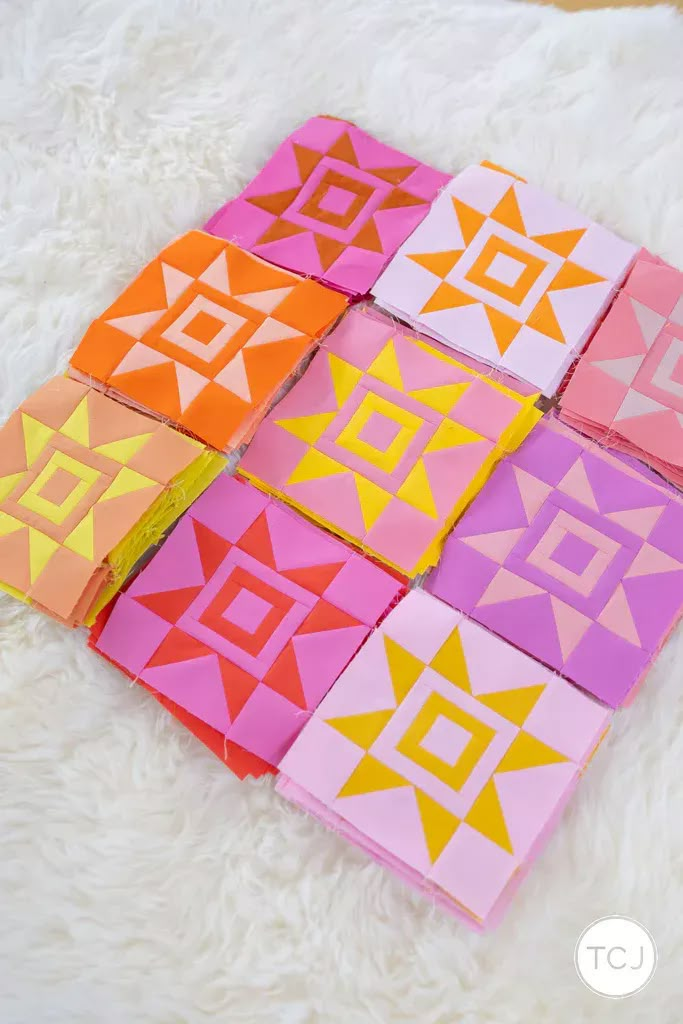 six different colored squares are arranged in the shape of an abstract pattern on a white rug