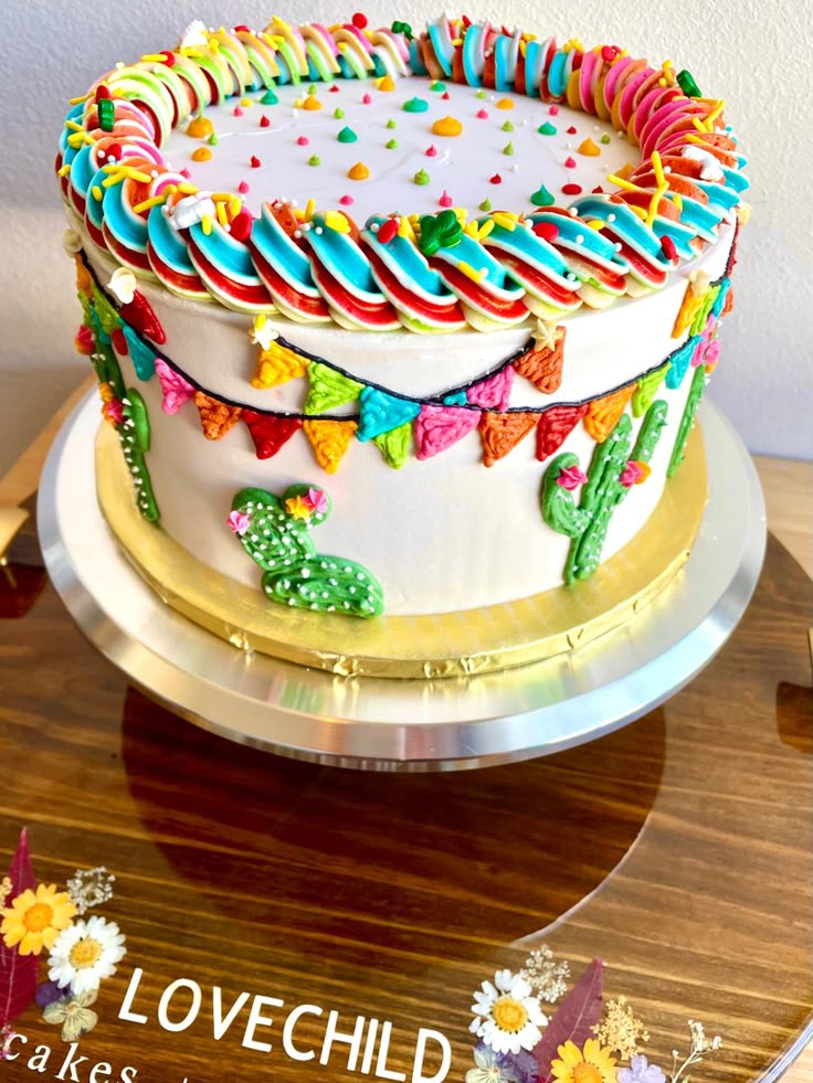 a colorful cake on top of a wooden table