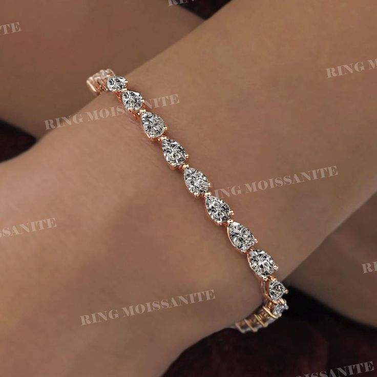 pear moissanite tennis bracelet,solid 10k/14k gold tennis bracelet,5mm eternity moissanite bracelet,luxury lab diamond tennis bracelet,women DESCRIPTION  -------------------- *Moissanite Details  →Stone                            :Pear →Size (mm)                      :5*3 →Stone Total CTW          :23 →Color                              :Colorless →Clarity                            :VVS  *Lab Diamond Details  →Stone                            :Pear →Size (mm)                      :5*3 →Stone To Luxury Gold Tennis Bracelet For Engagement, Luxury Pear-shaped Tennis Bracelet For Wedding, Pear-shaped Fine Jewelry Tennis Bracelet For Anniversary, Elegant Pear-shaped Tennis Bracelet With Brilliant Cut, Moissanite Tennis Bracelet - Fine Jewelry Gift, Moissanite Bracelet, Bracelet Luxury, Gold Tennis Bracelet, Plus Size Rings