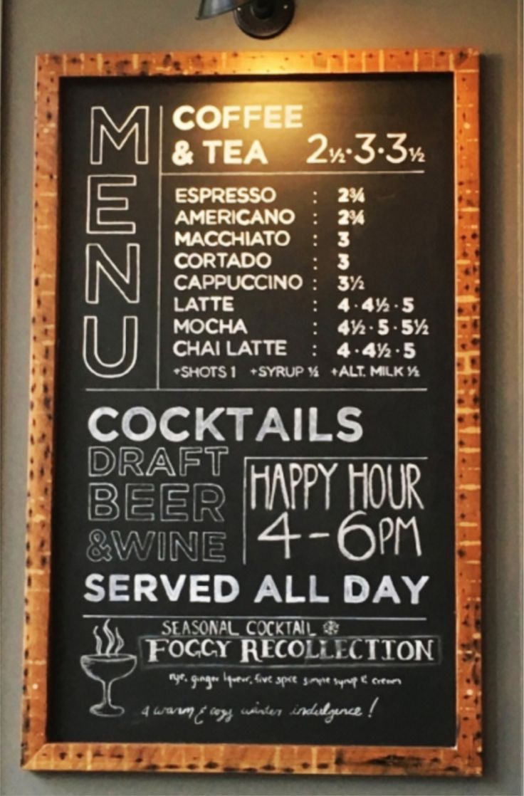 a menu board is hanging on the wall