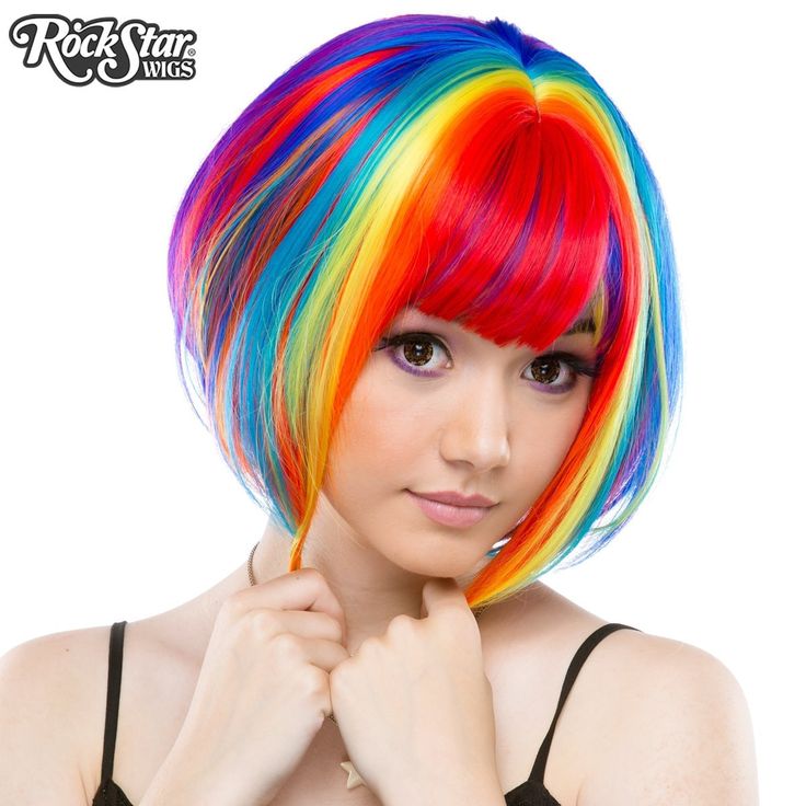 This dramatic, wedge-shaped bob is a popular style among fashionistas! Short in the back and long in the front, it comes with longer bangs, leaving you with endless styling opportunities!   Model: Mynx Midnight Can take heat up to 360 degrees Adjustable Weft Unisex Washable Langer Pony, Long Layers With Bangs, Rainbow Wig, Rainbow Hair Color, Rainbow Rocks, Wig Party, Long Bangs, Bob Wig, Rainbow Hair