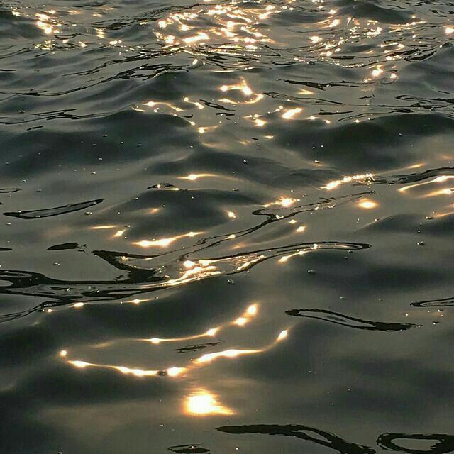 the sun shines brightly in the water as it reflects on the surface of the water