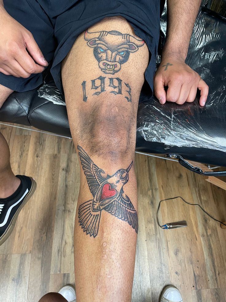 a man with a tattoo on his leg