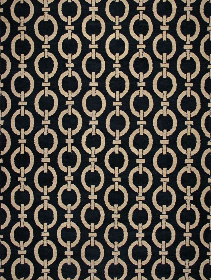 a black and white rug with circles on it