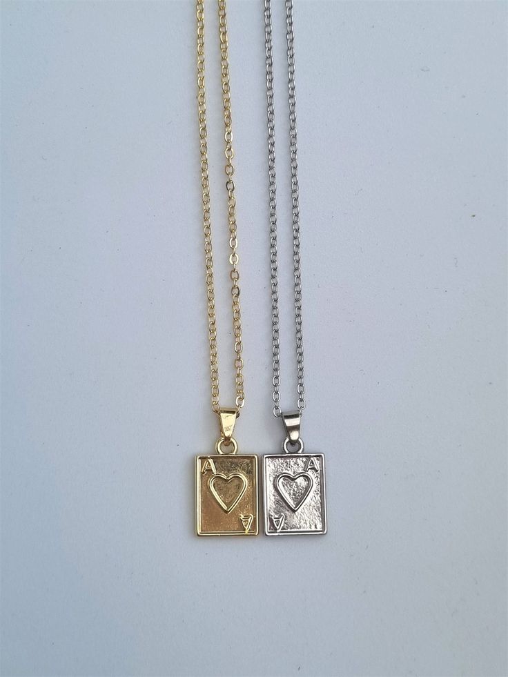 PLEASE NOTE:  - Price is for one necklace (£7.50).  - 2 Piece G/S Set: includes one gold and one silver necklace (£13.50) Matching earrings found on my page :) https://www.etsy.com/uk/listing/1210353417/ace-of-hearts-earrings-anime-drop Ace of hearts necklace, Poker necklace, LQBTQ necklace, matching necklace. These mini dainty necklaces are simple yet beautiful. A perfect treat yourself gift or a gift for a loved one! Necklace chain is approx. 40 cm (15.7 inches) with 5cm extending chain.  Gold Ace Necklace, Relationship Necklaces, October Jewelry, Matching Necklaces For Couples, Dainty Jewellery, Dainty Necklaces, Ace Of Hearts, Bff Necklaces, Best Friend Jewelry