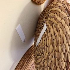 a close up of a straw hat on a wall