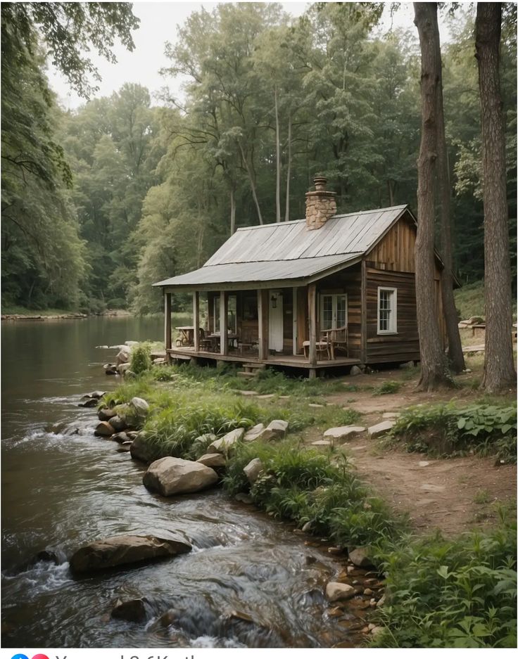 a small cabin sits on the bank of a river