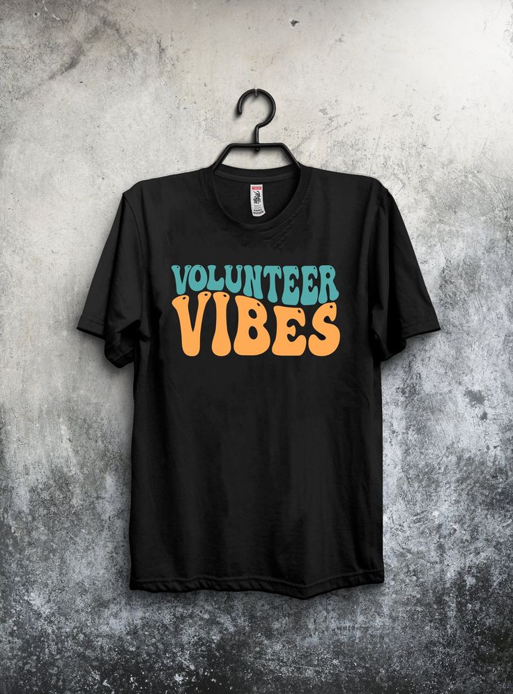 "Elevate your volunteer spirit with our \"Volunteer Vibes\" unisex t-shirt! Designed in a nostalgic retro font, this tee is not only stylish but also carries a powerful message of community support and giving back. 🌟 Key Features: High-quality, soft, and comfortable fabric for everyday wear. Classic unisex fit that suits all body types. \"Volunteer Vibes\" is designed in a charming retro font for a vintage feel. Perfect for volunteers, charity events, community gatherings, or casual wear. A gre Volunteer Shirt Ideas, Volunteer T Shirt Design Ideas, Volunteer Shirts Design, Volunteer Tshirts Design, Charity T Shirt Design, Volunteer Shirt, Volunteer Gifts, Charity Events, Group Shirts